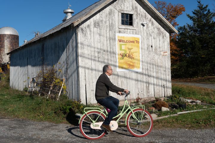 Alan biking around the solar-powered cheese creamery